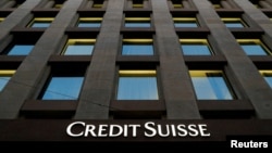 FILE - The Credit Suisse logo is pictured on a bank in Geneva, Switzerland, Oct. 17, 2017.