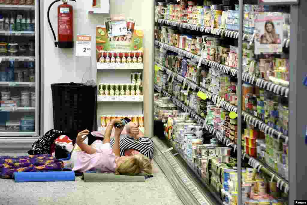A local grocery store invited customers for a sleepover to cool off as the heatwave continues in Helsinki, Finland, Aug. 4, 2018.