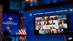 President-elect Joe Biden speaks during a virtual meeting with members of his national security and foreign policy agency review teams at The Queen theater, in Wilmington, Del., Dec. 28, 2020.