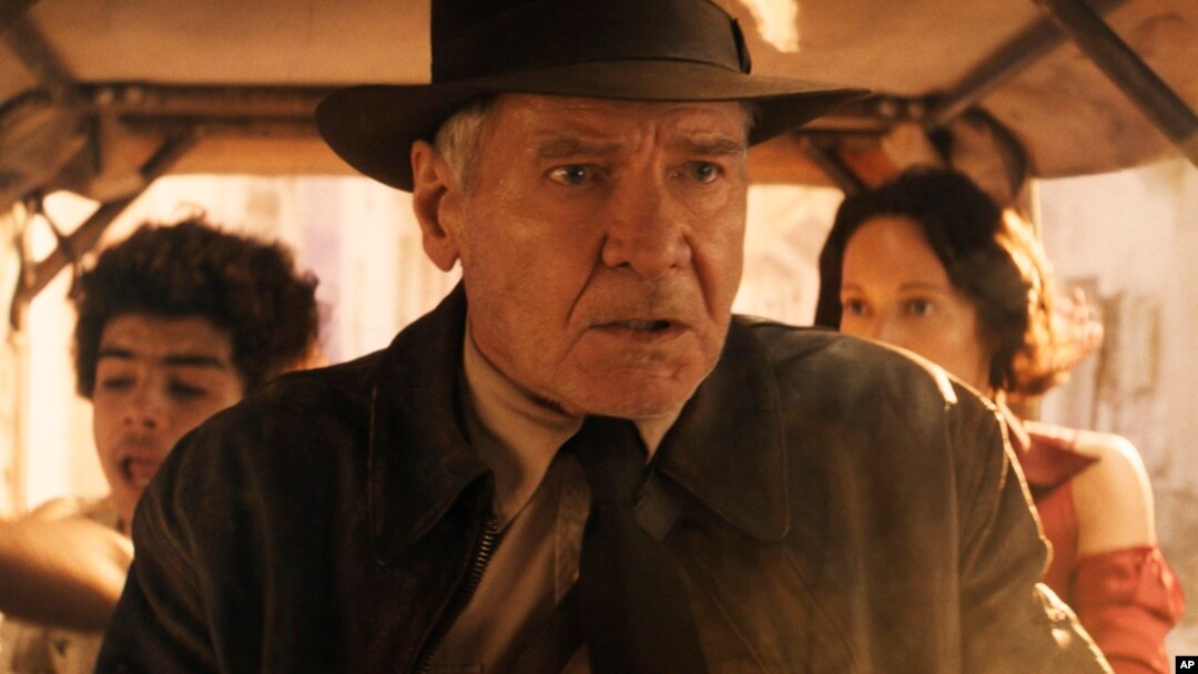 This image released by Lucasfilm shows Ethann Isidore, from left, Harrison Ford and Phoebe Waller-Bridge in a scene from "Indiana Jones and the Dial of Destiny."