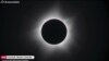 In this screengrab taken on April 20, 2023 from Timeanddate, Perth Observatory, and Learmonth Solar Observatory video footage via AFPTV, the moon blocks out the sun during a full solar eclipse in Western Australia's town of Exmouth.