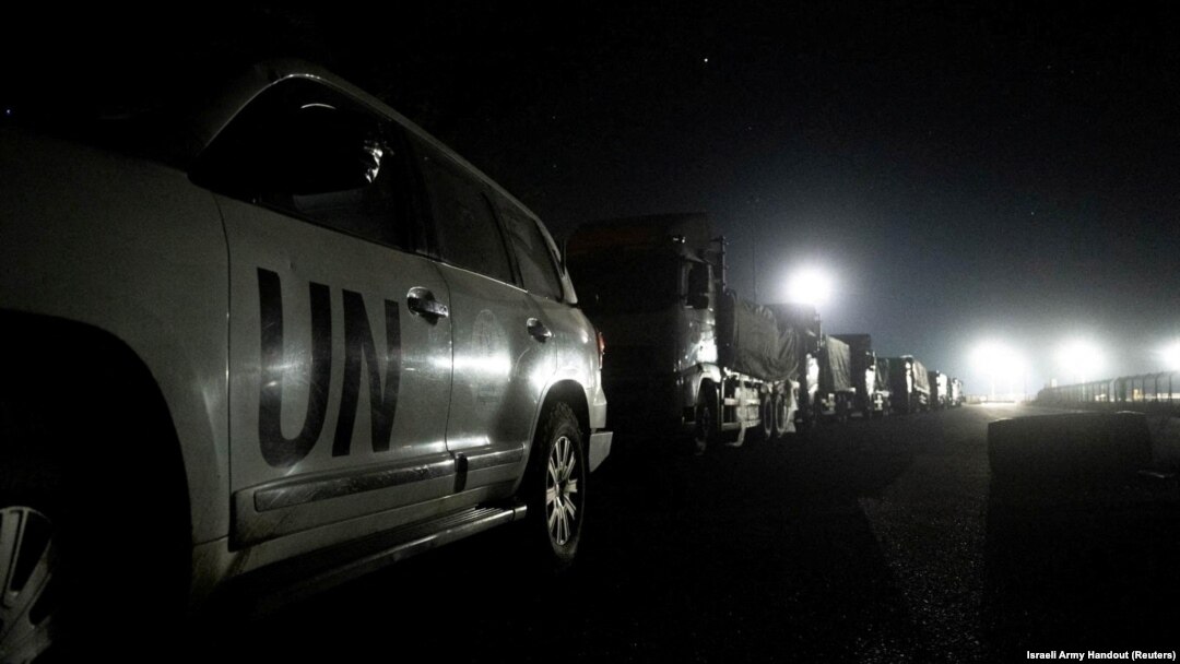 Trucks containing humanitarian aid from the World Food Program are parked in a location given as northern Gaza Strip, in this handout image released on March 12, 2024. 