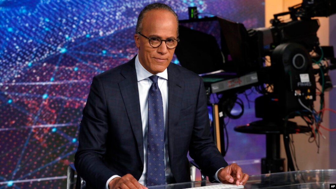 FILE - NBC Nightly News and Dateline anchor Lester Holt poses for photos on the Nightly News set, at NBC headquarters, in New York, July 31, 2019.
