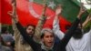 Pakistan Tehreek-e-Insaf (PTI) party activists and supporters of Pakistan's former Prime Minister Imran Khan celebrate after Supreme Court declared Khan's arrest "invalid", in Lahore, Pakistan, May 11, 2023.