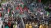 Supporters of Pakistan Democratic Alliance protest outside the Supreme Court, in Islamabad, May 15, 2023. Protesters demanded the resignation of the chief justice over ordering the release of former Prime Minister Imran Khan.