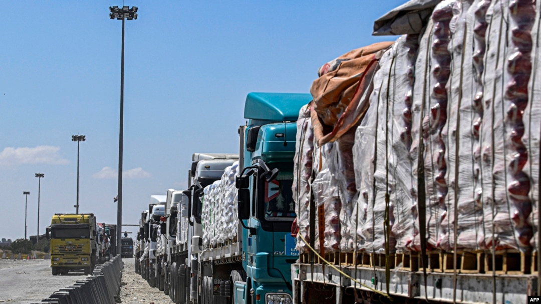 Egyptian trucks carrying humanitarian aid bound for the Gaza Strip queue outside the Rafah border crossing on the Egyptian side on March 23, 2024. UN secretary-general says it is 'moral outrage' that aid is being blocked from being sent into Gaza.