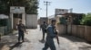 FILE - Security personnel stands guard outside United Nations Assistance Mission in Afghanistan (UNAMA) office compound in Guzara district of Herat province on July 31, 2021.