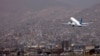 FILE - An Ariana Afghan Airlines aircraft takes off from the airport in Kabul, Sept. 11, 2021.