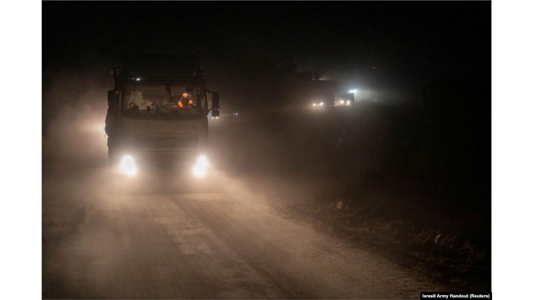 A truck containing humanitarian aid from the World Food Program moves in a location given as northern Gaza Strip, in this handout image released March 12, 2024.