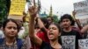 Protesters condemn the rape and murder of a doctor inside a government hospital in Kolkata, India, Aug. 14, 2024. 