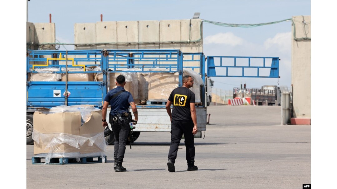 Trucks carrying humanitarian aid slated for Gaza await clearance at the Kerem Shalom (Karm Abu Salem) border crossing on March 14, 2024 amid the ongoing conflict between Israel and the Palestinian militant group Hamas.