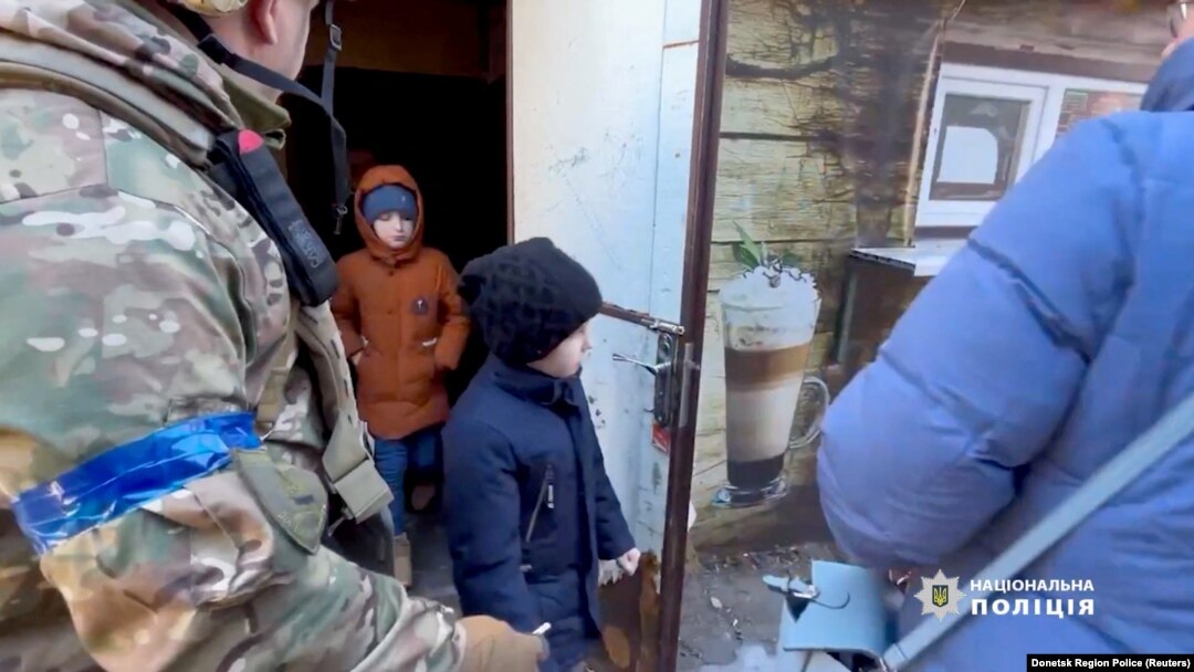 Residents evacuate Avdiivka in the Donetsk Region of Ukraine, in this screen grab from a handout video released on March 8, 2023. (Donetsk Region Police/Reuters)