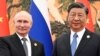2023年10月18日俄罗斯总统普京(左)与中国国家主席习近平在北京出席“一带一路”高峰论坛期间举行会晤