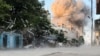 Smoke rises following an Israeli strike on a residential building, amid the ongoing conflict between Israel and Hamas, in Nuseirat in the central Gaza Strip, in this screen grab taken from video, Aug. 18, 2024.
