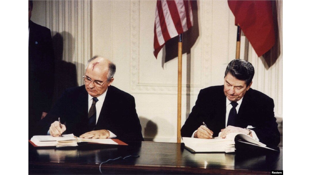FILE - U.S. President Ronald Reagan, right, and Soviet President Mikhail Gorbachev signing the Intermediate-Range Nuclear Forces treaty at the White House, Washington, on Dec. 8 1987. (REUTERS/Dennis Paquin/File Photo)