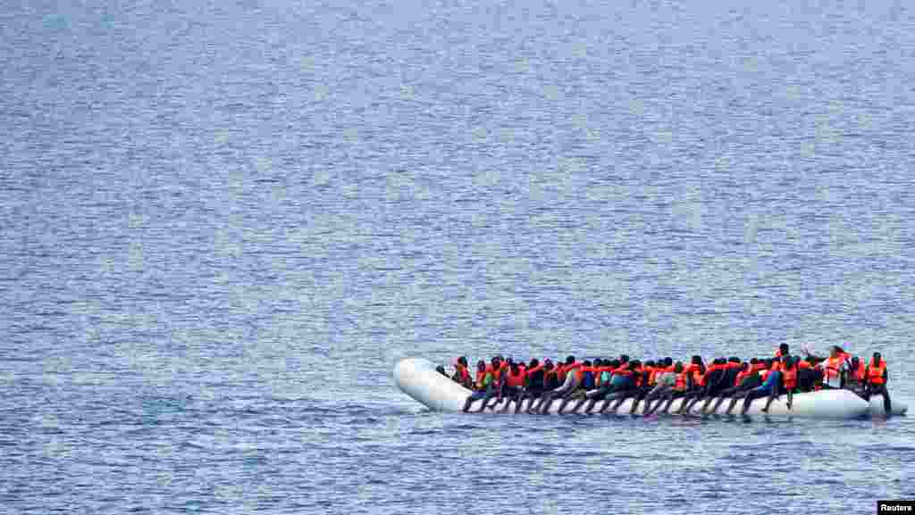 Migrants wait to be rescued by "Save the Children" NGO crew from the ship Vos Hestia in the Mediterranean sea off Libya coast.