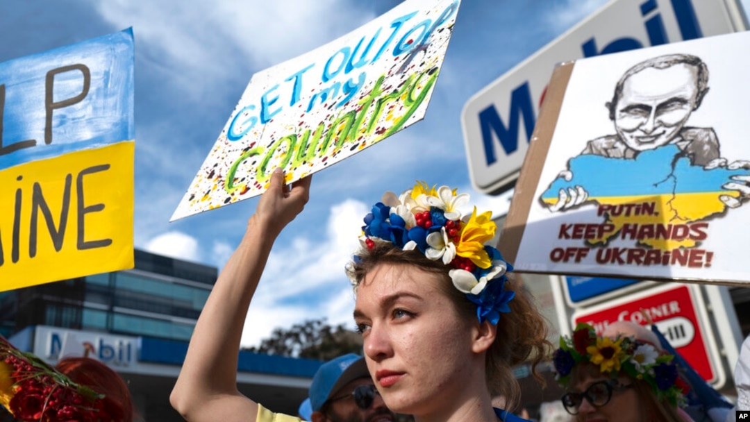 A Ukrainian protester holds a sign during a demonstration against the Russian invasion of Ukraine in Los Angeles, Feb. 26, 2022.