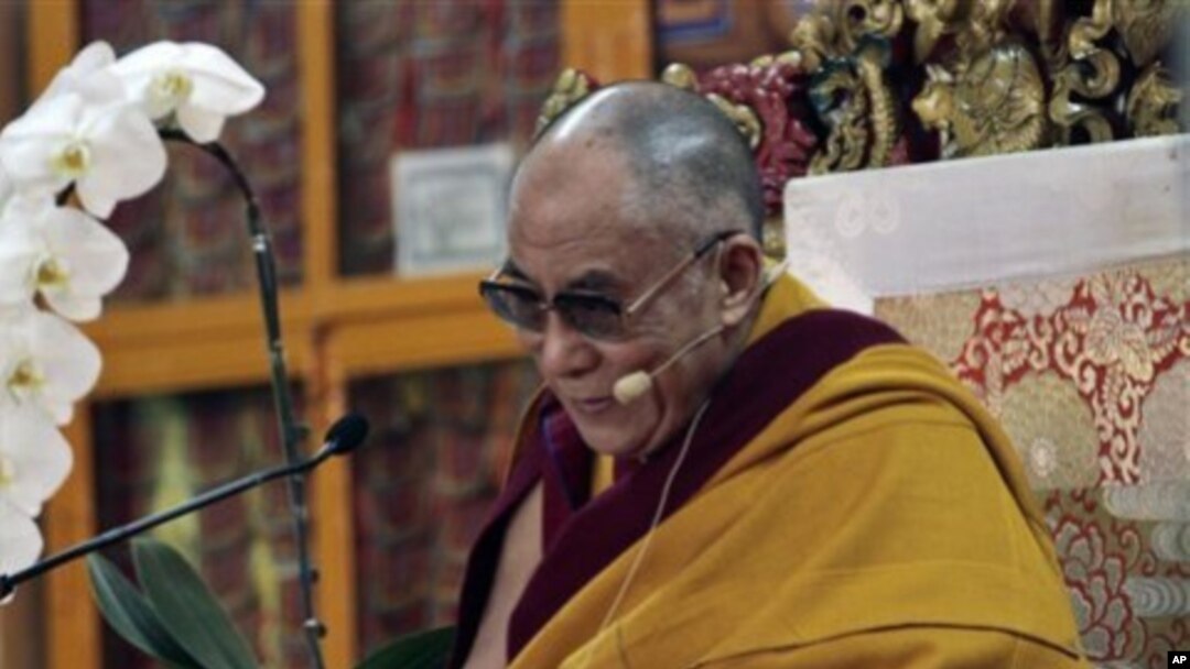 Tibetan spiritual leader the Dalai Lama reacts during a religious talk at the Tsuglakhang temple in Dharmsala, India, March 15, 2011