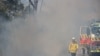 New South Wales Rural Fire Service personnel conduct a controlled burn to eliminate fuels before the upcoming bushfire season in the Arcadia suburb of Sydney, Australia, Sept. 8, 2020.