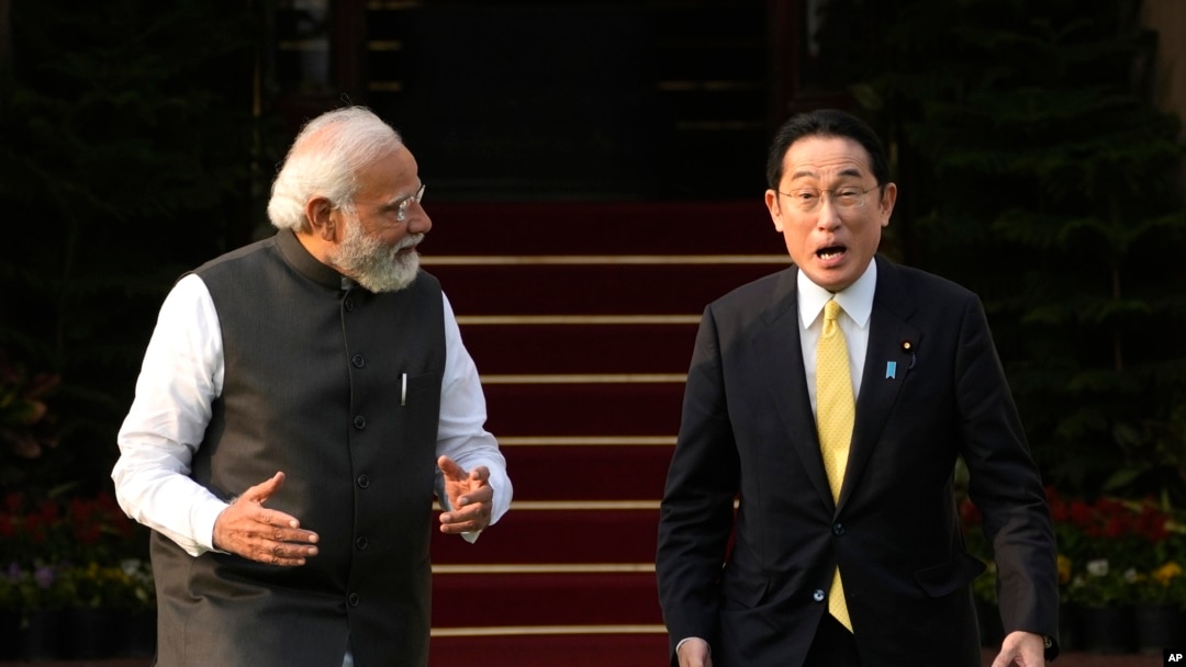 Indian Prime Minister Narendra Modi walks with his Japanese counterpart Fumio Kishida in New Delhi, March 19, 2022. Kishida is meeting with Modi to strengthen their partnership in the Indo-Pacific and beyond.