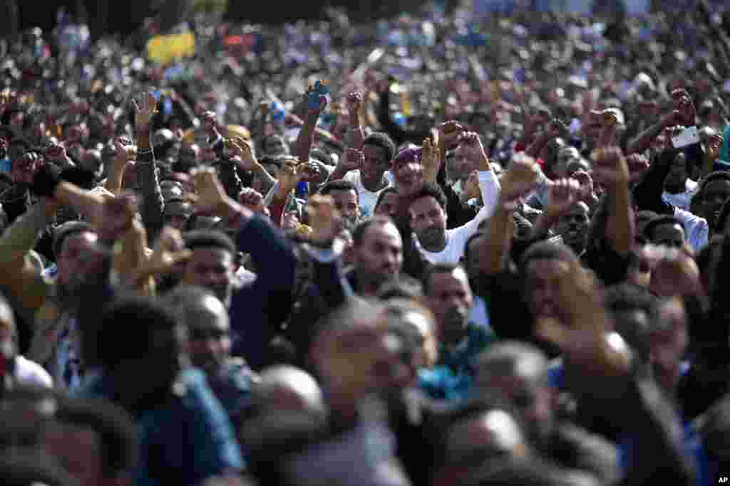 FILE - African migrants chant slogans during a protest in Rabin's square in Tel Aviv, Israel, Sunday, Jan. 5, 2014.