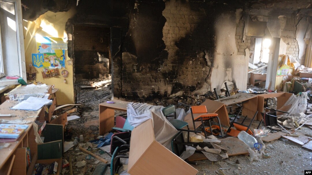 FILE - A classroom is littered with debris at a school hit by a Russian air bomb in Kharkiv, Ukraine, March 23, 2022.