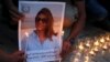 Family and friends of al-Jazeera reporter Shireen Abu Akleh attend a candle vigil outside the Church of the Nativity in the West Bank Biblical city of Bethlehem on May 16, 2022.