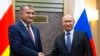 FILE - Russian President Vladimir Putin, right, and Anatoly Bibilov, president of Georgia's breakaway province of South Ossetia, shake hands during their meeting in Novo-Ogaryovo residence, outside Moscow, Russia, on Nov. 14, 2017. 