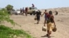 Yemeni pro-government fighters carry explosives and land mines planted by the Huthis on June 8, 2018, near the city of Al Jah in the Hodeida province, 50 kilometers from the port city of Hodeida, which the Iran-backed Huthi insurgents seized in 2014.