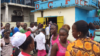 Students who can no longer attend schools and universities because the government temporarily closed them due to Ebola, take to the streets to protest, at NGO headquarters, Monrovia, Liberia, Sept. 29, 2014. (Benno Muchler/VOA)