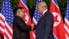 U.S. President Donald Trump shakes hands with North Korea leader Kim Jong Un at the Capella resort on Sentosa Island, June 12, 2018, in Singapore. 