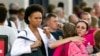 Family and friends greet staff of the Naval Sea Systems Command headquarters after they were bused from the Washington Navy Yard 