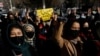 FILE - Afghan women chant slogans to protest the closure of universities to women by the Taliban in Kabul, Afghanistan, Dec. 22, 2022. 