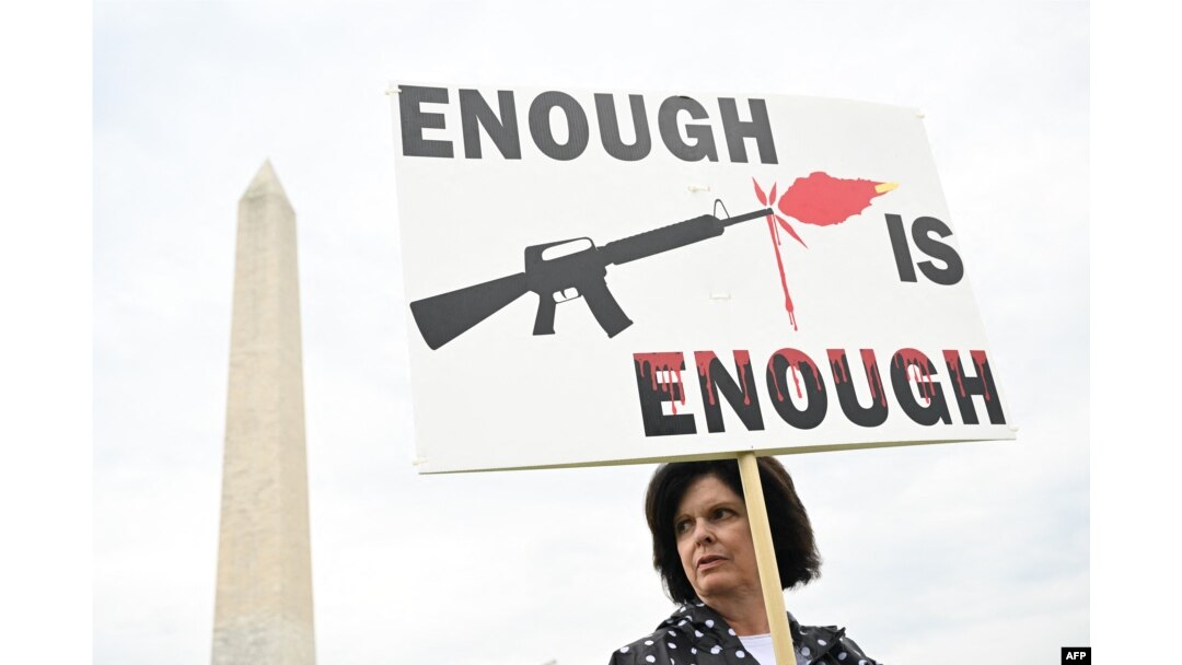 FILE - A gun control advocate participates in the "March for Our Lives" rally against gun violence, near the Washington Monument on the National Mall in Washington, June 11, 2022.