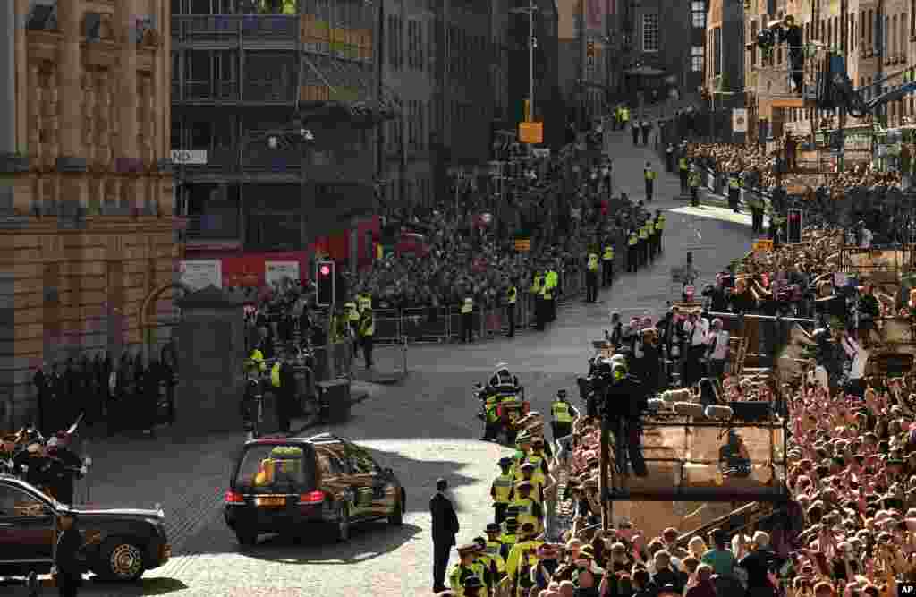 The hearse carrying the coffin of Queen Elizabeth II leaves St. Giles' Cathedral, in Edinburgh, Sept. 13, 2022