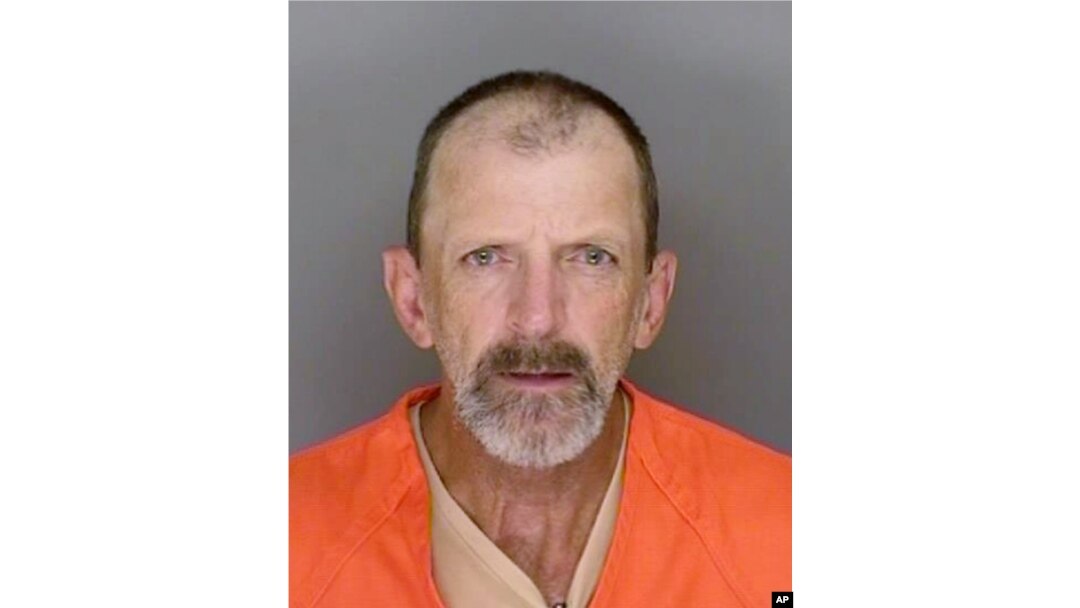 This undated booking photo provided by the Santa Cruz County, Calif., Sheriff's Office shows Marlon Coy, who is suspected of starting a wildfire that destroyed two homes in Northern California and is facing multiple arson charges.