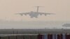 A U.S. Air Force aircraft carrying COVID-19 relief supplies from the U.S. prepares to land at the Indira Gandhi International Airport's cargo terminal in New Delhi, India, April 30, 2021.