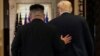 U.S. President Donald Trump and North Korea's leader Kim Jong Un leave after signing documents that acknowledge the progress of the talks and pledge to keep momentum going.