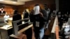 South African police officers arrested on suspicion of murder appear for bail hearing east of Johannesburg on March 11, 2013. Nine South African policemen pleaded not guilty to charges of murdering a Mozambican taxi driver who has handcuffed and dragged behind a police vehicle.