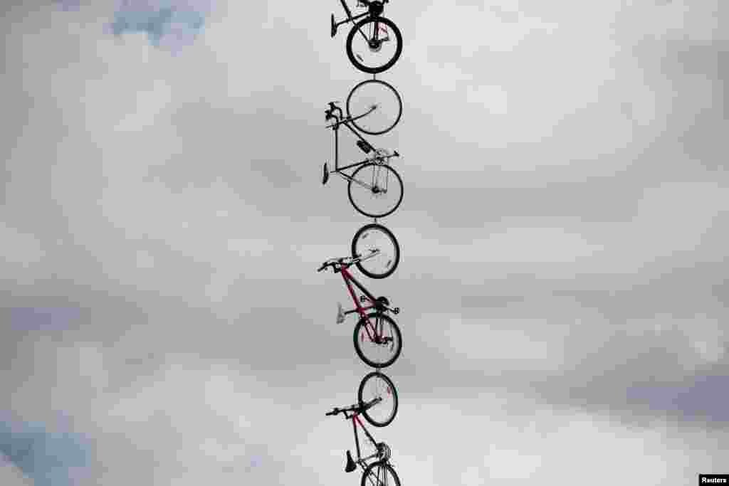 Bikes are seen hanging next to the road during the third stage of the Tour de France cycling race over 212.5 kilometers (132 miles) with start in Verviers, Belgium and finish in Longwy, France.
