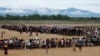 Rohingya refugees line up to receive food at a camp near Teknaf, Bangladesh, Oct. 12, 2017.