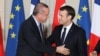 French President Emmanuel Macron greets Turkish President Recep Tayyip Erdogan during a joint news conference at the Elysee Palace in Paris, France, Jan. 5, 2018.