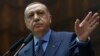 Turkey's President Recep Tayyip Erdogan addresses his supporters at the parliament in Ankara, Turkey, Nov. 28. 2017.