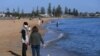 People enjoy the sunshine at Elwood beach in Melbourne, Australia, Sept. 14, 2020.