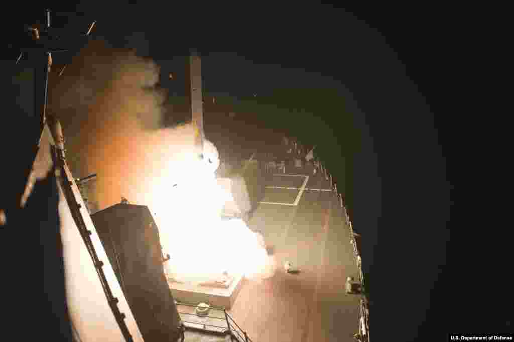 The guided-missile destroyer USS Arleigh Burke launches Tomahawk cruise missiles. Arleigh Burke is deployed in the U.S. 5th Fleet area of responsibility supporting maritime security operations and theater security cooperation efforts, Red Sea, Sept. 23, 2014 (U.S. Navy photo by Mass Communication Specialist 2nd Class Carlos M. Vazquez II/Released)