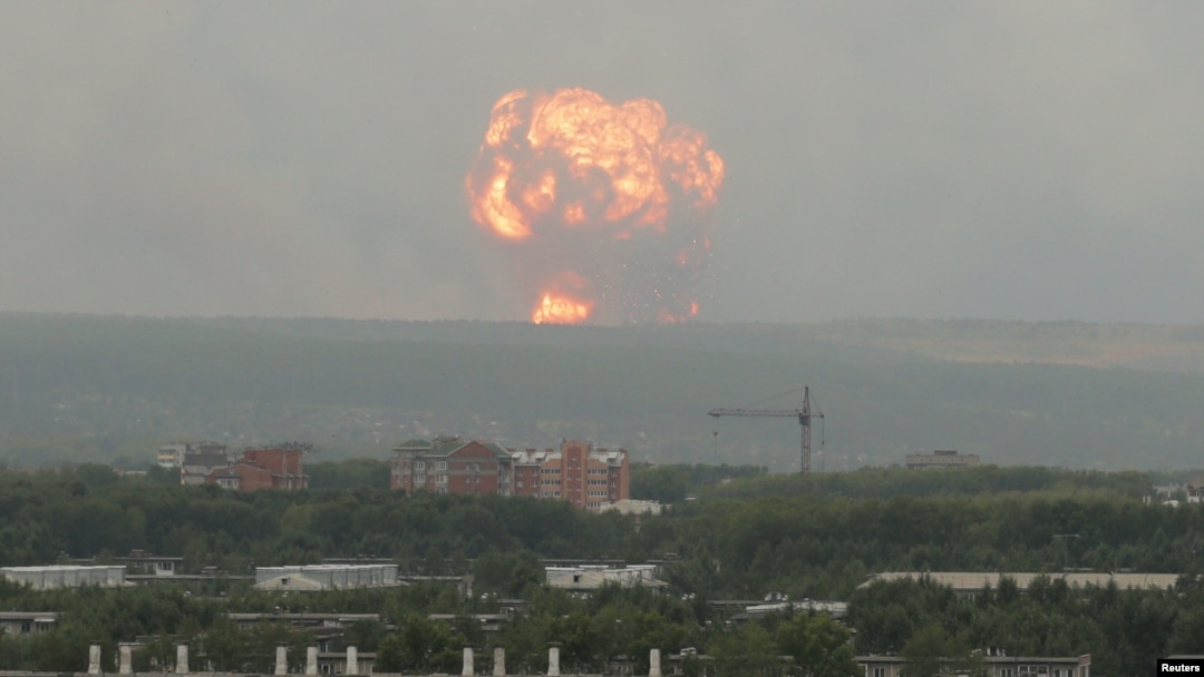 Flame and smoke rise from the site of blasts at an ammunition depot near the town of Achinsk in Krasnoyarsk region, Russia.