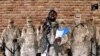 FILE - Boko Haram leader Abubakar Shekau speaks in front of guards at an unknown location in Nigeria in this still image taken from an undated video obtained Jan. 15, 2018. 