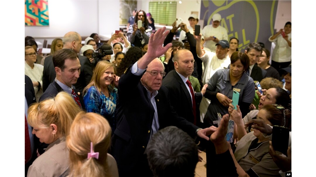 Democratic presidential candidate Sen. Bernie Sanders of Vermont waves to hotel workers at MGM Grand hotel and casino in Las Vegas, Feb. 20, 2016.