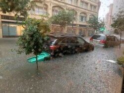 Vehicles sit in high water after heavy rain in New Orleans, July 10, 2019, in this image obtained from social media.