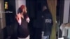 FILE - This screen grab taken from a video released on April 24, 2015 by the Italian police shows a man (L) suspected to be a member of an armed organization inspired by al-Qaida and other radical organizations. 